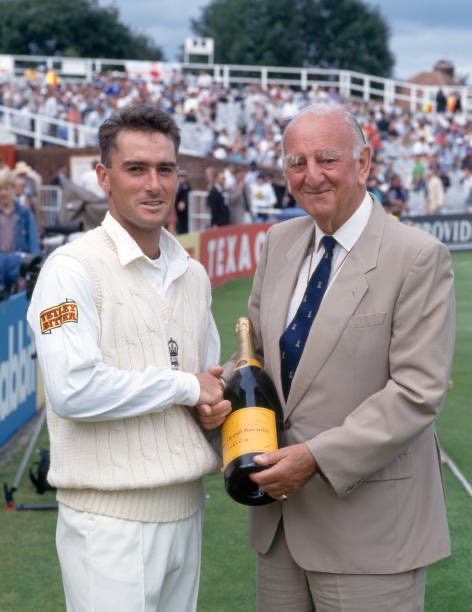 I was delighted to stumble across this photo and thought it worth sharing.

Graham Thorpe is being presented with a bottle of champagne by Brian Johnston for scoring 114 not out on his Test debut in 1993.