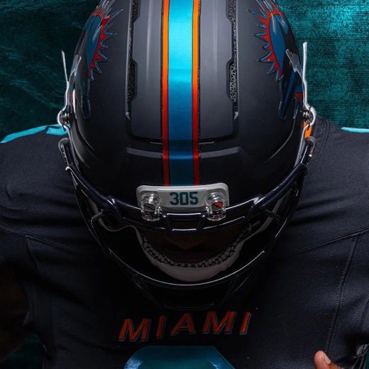 DubCreative's tweet photo. Night Mode Activated! An amazing collab with the @MiamiDolphins @Nike and @RiddellSports #NFLRivalries https://t.co/nw6Xb35srj