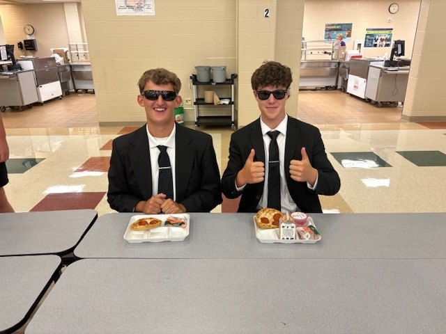 Our WHS Marketing students have been busy visiting our younger schools to spread the word about their t-shirt sales! While at MMS, they couldn’t resist stopping by the cafeteria for a pizza lunch and a little walk down memory lane!
