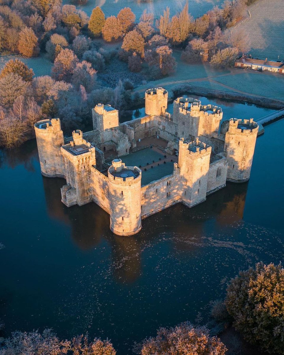 Bodiam Castle, built in the 14th century, is located near Robertsbridge in East Sussex, England.