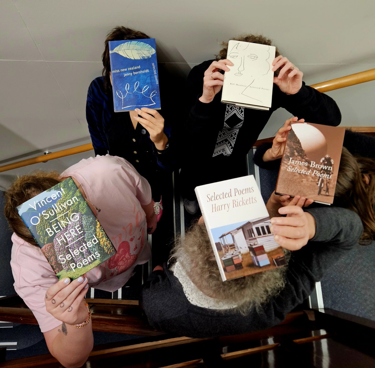 Driven to total silliness by a month of packing and posting 1500 books sold in the August sale, the THWUP team are shown here cowering together in a stairwell with various volumes of Selected Poems on their heads. Buy some Selected Poems! Half price!

teherengawakapress.co.nz/collections/po…