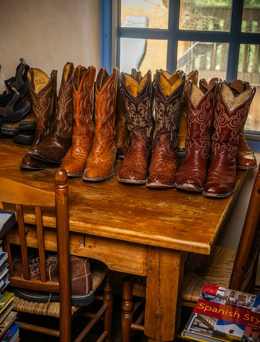 AmericanGwyn's tweet image. Can't decide if I'm more impressed by Cormac McCarthy's collection of books or his collections of boots.