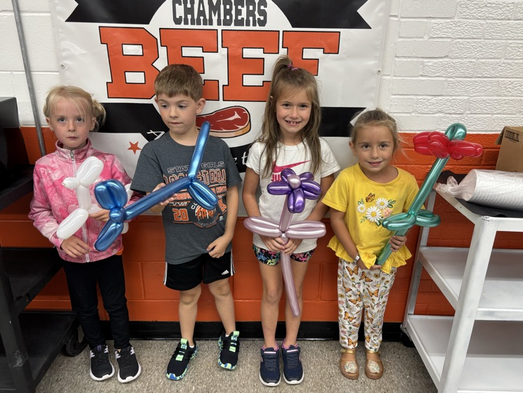 It's balloon Friday, students with upcoming birthdays got their choice of a dog, flower or hat.