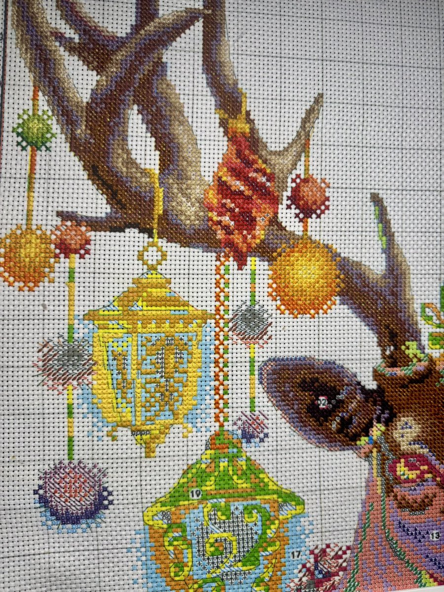 FablesFios's tweet photo. Tiny progress last night 🦌 Mixed up colours, so I frogged a chunk. At least the lanterns are glowing! #crossstitch #wip #stitchersofX https://t.co/vtPpwaqsOC