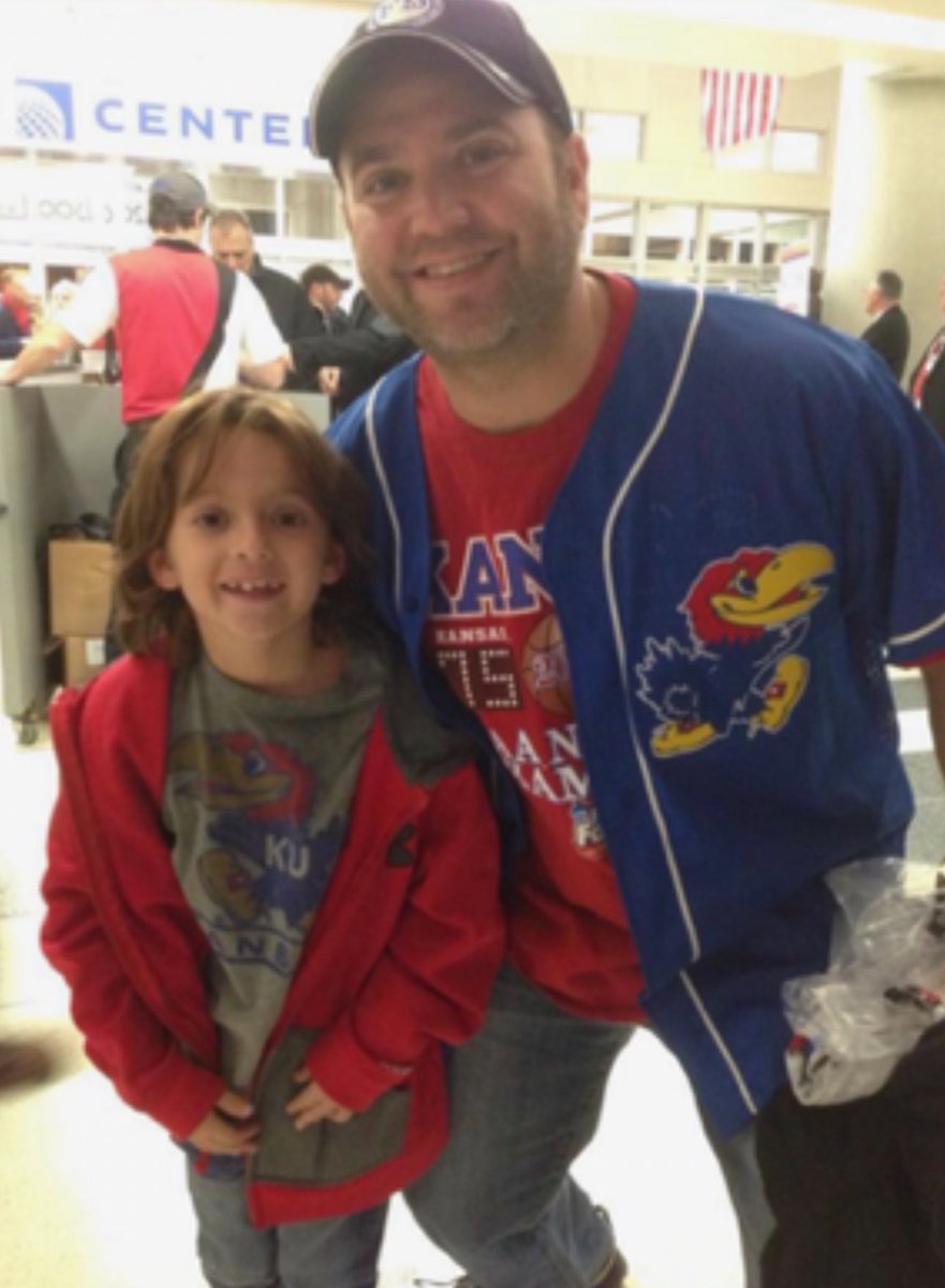 BHanni's tweet photo. Tonight’s #KUCancerFighter tribute celebrates the life of Darren Kaye, a loving husband & father of 2 from Buffalo Grove, IL, whose courageous fight with kidney cancer ended earlier this summer at the age of 54. When Darren was originally diagnosed over 7.5 years ago, he was given only a small chance of living a few years, but in true Darren fashion, he defied those odds, fighting with determination & incredible strength.
 
Darren’s greatest joy was being a husband & father, and every decision he made was rooted in his deep love for his family. One of his lifelong passions was the University of Kansas. KU wasn’t just his alma mater—it was a community that shaped him & gave him lifelong friendships that he cherished deeply. Darren’s pride in being a Jayhawk was immeasurable. His wife recalls him always carrying his KU ID in his wallet and always proudly showing it off to prove he went to KU. His Jayhawk pride reached new heights when his son Carson chose to follow in his footsteps and attend KU as well. Darren was over the moon, knowing that his legacy & love for KU would continue through his son.

Darren’s story is one of perseverance, loyalty and love. Though his time was cut far too short, he left a legacy of strength, humor, and his devotion to all things University of Kansas. His family in confident that legacy will live on through Julie, Carson, and Landon, and through the many KU friendships and memories he made throughout his life. Kaye Family, tonight’s call is for you & dedicated to an all-time great Jayhawk. ❤️💙