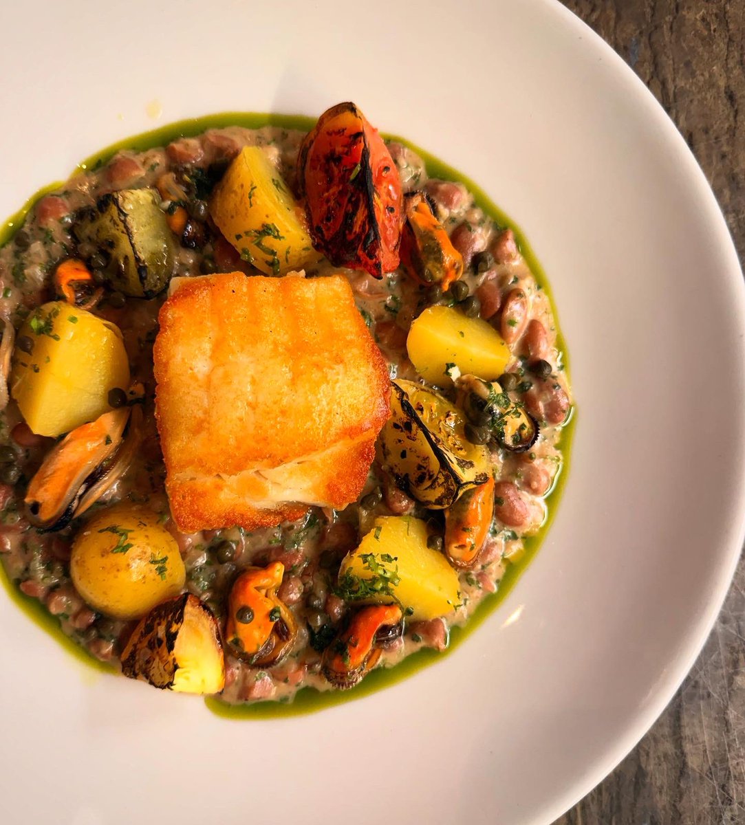 hispibistro's tweet photo. Pan-roasted cod loin, Shetland mussels, borlotti bean cassoulet, heritage tomatoes and new potatoes. A delicious special from Chef Roland. A hit yesterday and back on today. Pair it with a cool Pinot Grigio and you’re onto a winner. https://t.co/kcrZb8Br8D