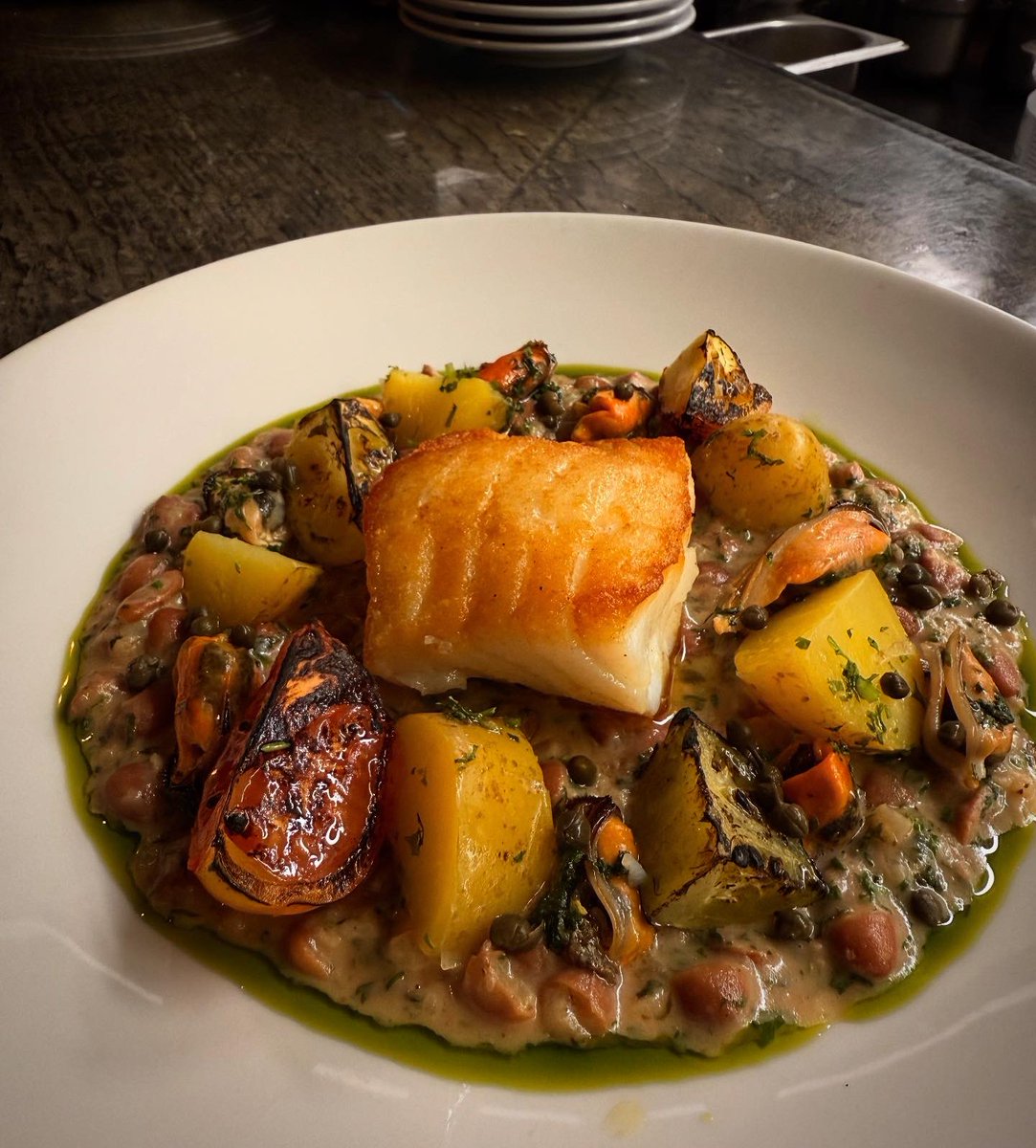 hispibistro's tweet photo. Pan-roasted cod loin, Shetland mussels, borlotti bean cassoulet, heritage tomatoes and new potatoes. A delicious special from Chef Roland. A hit yesterday and back on today. Pair it with a cool Pinot Grigio and you’re onto a winner. https://t.co/kcrZb8Br8D