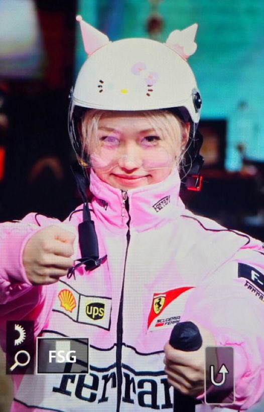 the hello kitty helmet and the pink jacket he looks so CUTE