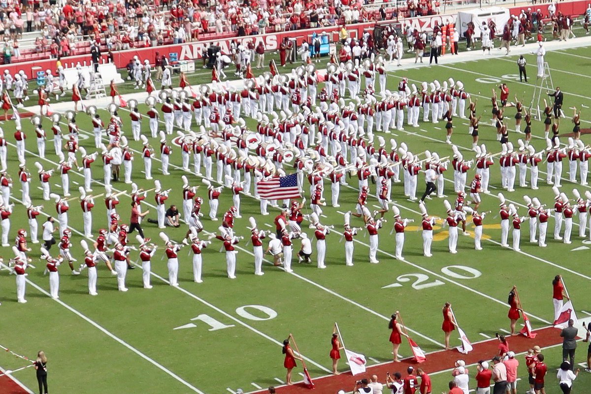 Hogs WIN 52-7! My favorite pic of the day was <a href="/whitten_donovan/">Donovan Whitten</a> running the American flag on the field today, beside his coach <a href="/CoachSamPittman/">Coach Sam Pittman</a>…who was running through that A again too! Proud of the Hogs! <a href="/RazorbackFB/">Arkansas Razorback Football</a>