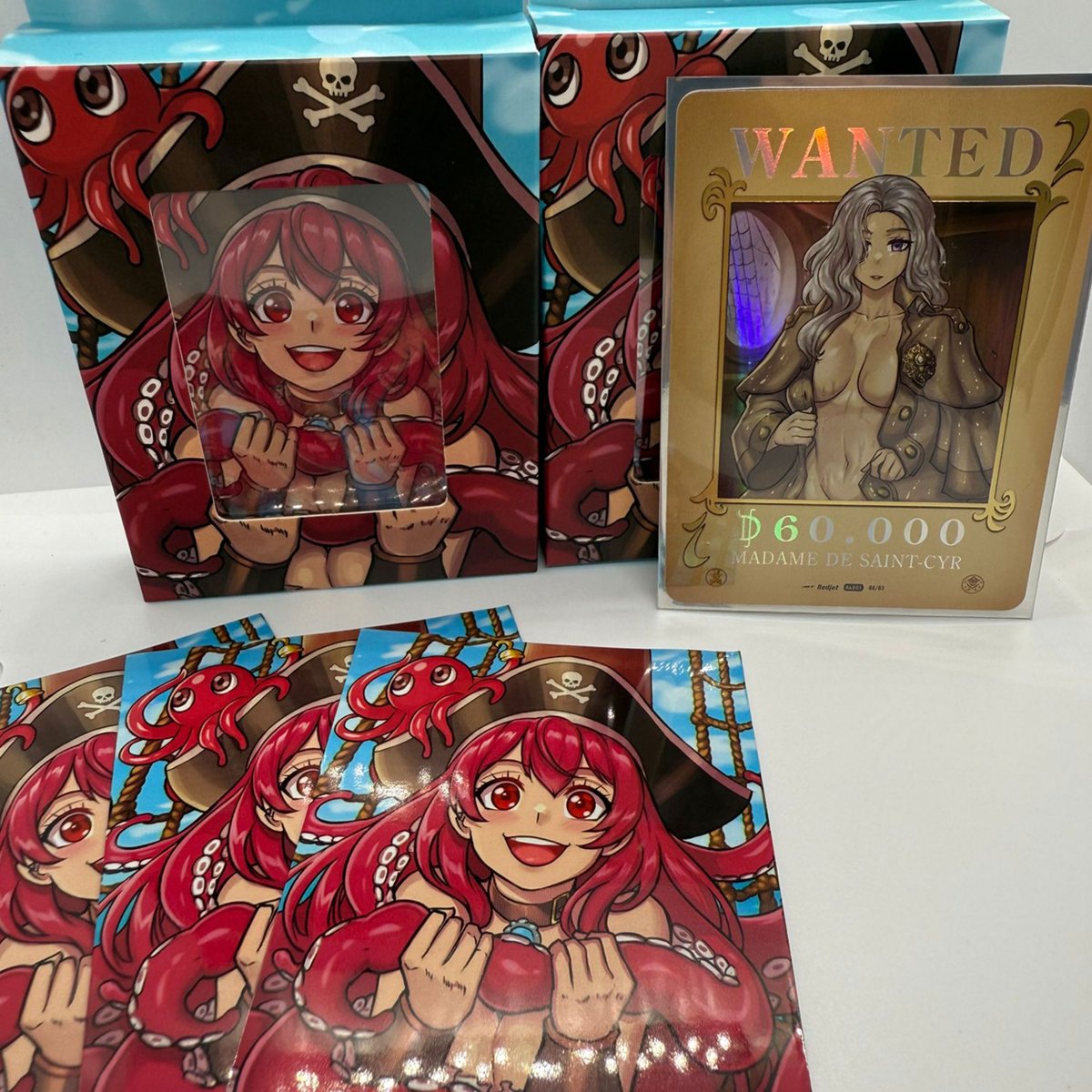 We’re very proud to announce that we’ve partnered with Tyranobox, French manufacturer of TCG protection products, to create the binders and sleeves for the Booty &amp; Beauties series.
The first items have just come off the press — take a look for yourself!
More pictures on IG!