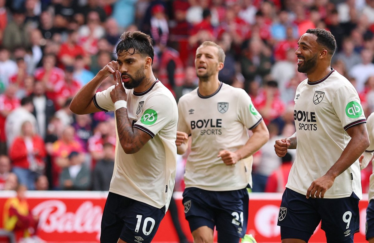 Lucas Paqueta appears to confirm he's staying at West Ham despite Aston Villa interest after scoring a penalty against Nottingham Forest. He makes a 'phone' signal before a 'throw away' gesture and kisses the West Ham badge.⚒️