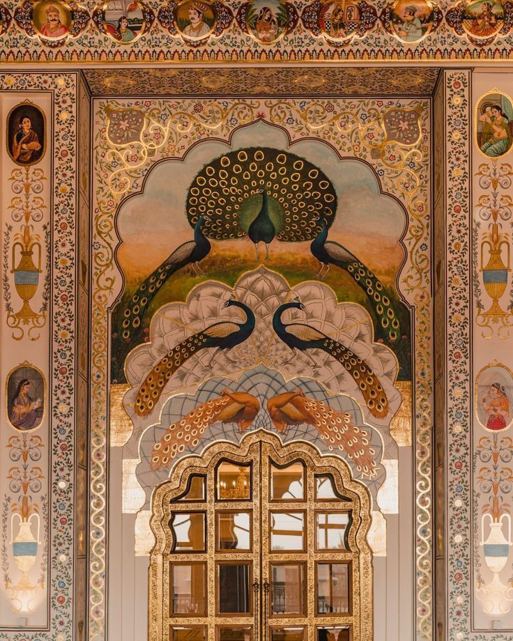 A beautifully adorned wall and door, featuring intricate artwork and traditional Indian motifs, likely from a palace or a luxurious hotel in Jaipur, Rajasthan, India 🇮🇳.