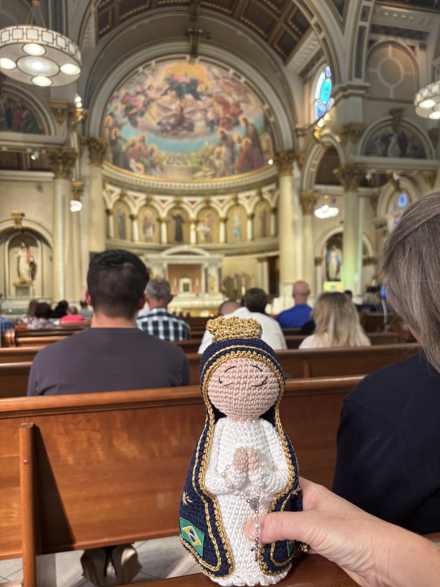 All summer, our Vianney College Catholic group used a crocheted 'Our Lady of Aparecida' doll, gifted by a Brazilian parishioner, during our Bible study to indicate who was speaking. When summer ended, I asked the group to carry her with them to Mass during their respective