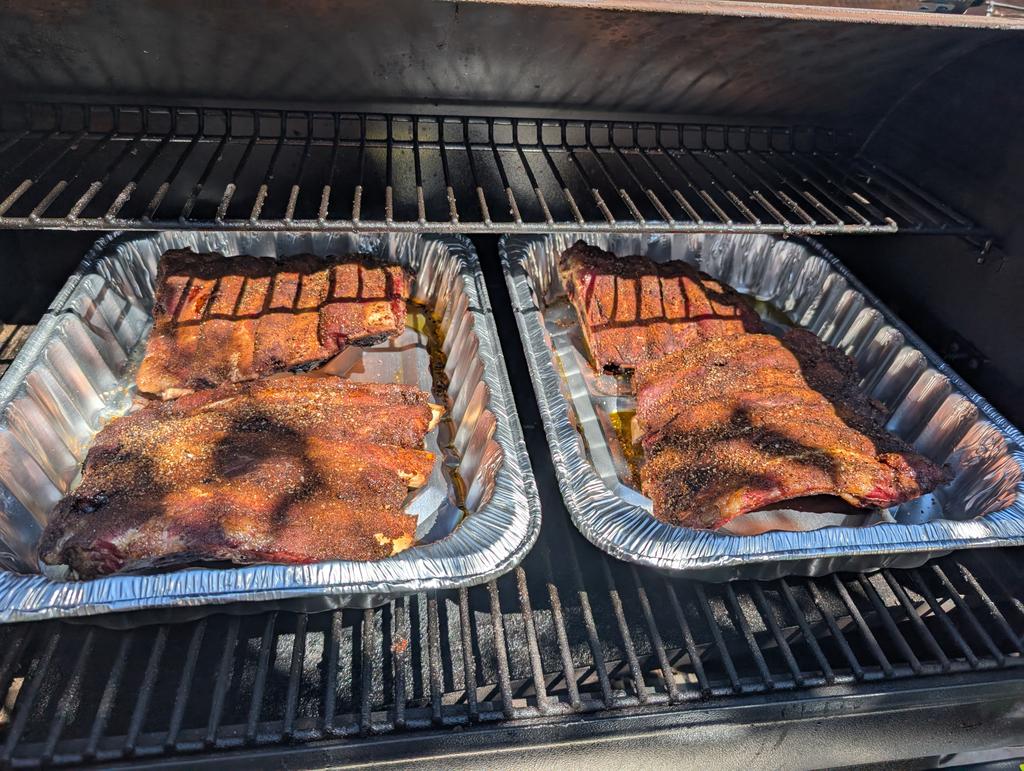 Beef ribs in the smoker, ready for braising.

Murrica.