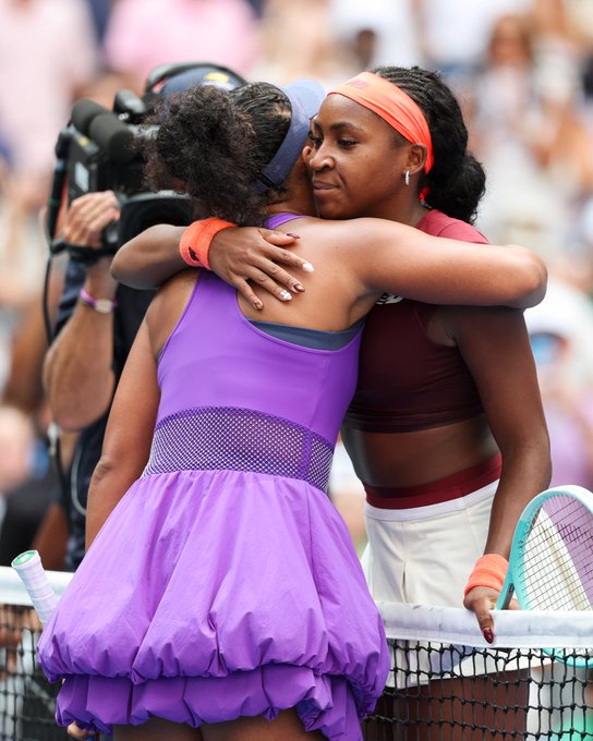 Naomi Osaka and Coco Gauff embrace at the net following their match. 