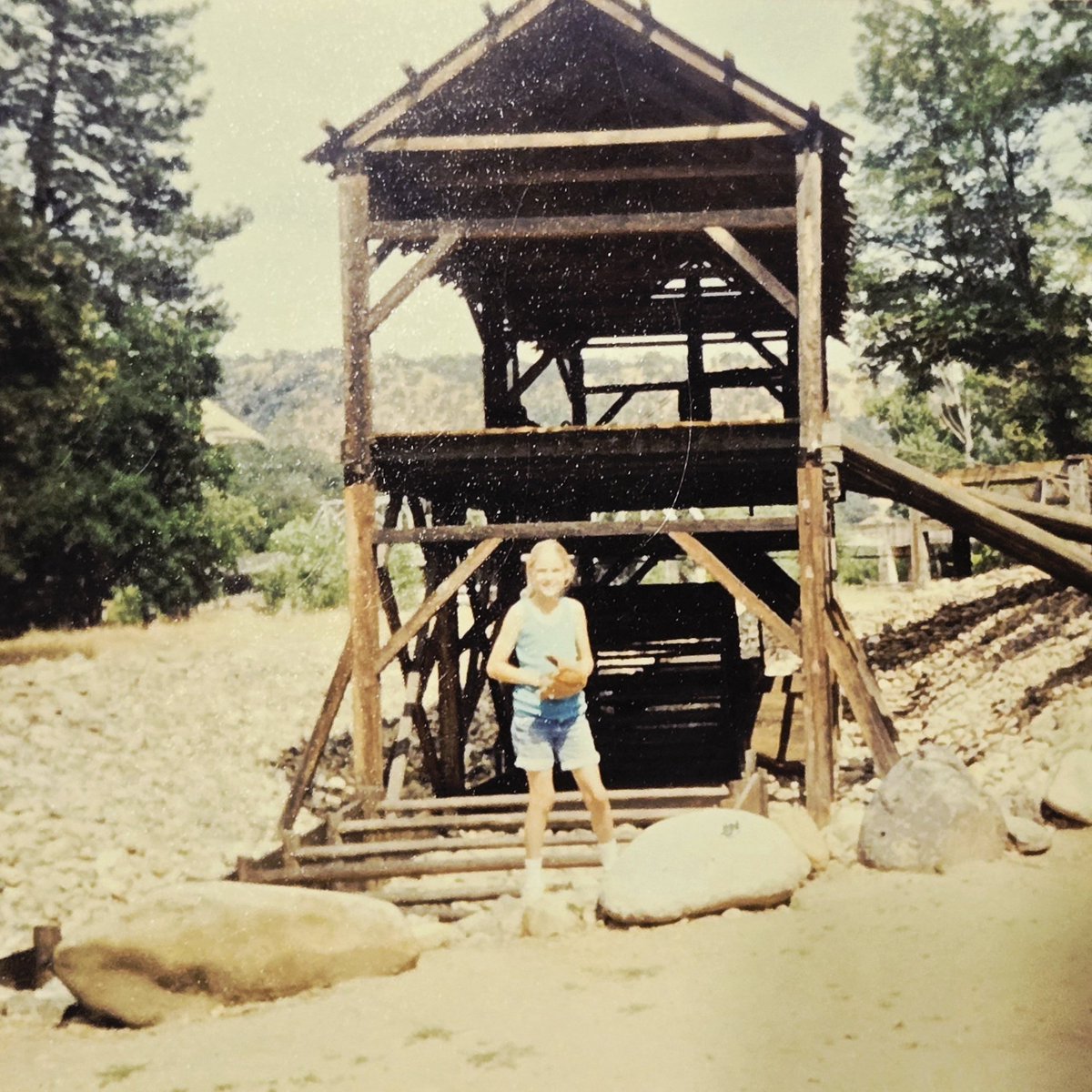 Ang_USL's tweet image. Labor Day flashback to Sutter's Mill, California 1990-something. I can't remember the exact year. But it was a day of panning for gold, a picnic, and playing catch with my siblings. Here's a picture of me in front of Sutter's Mill. #LaborDayWeekend #memories