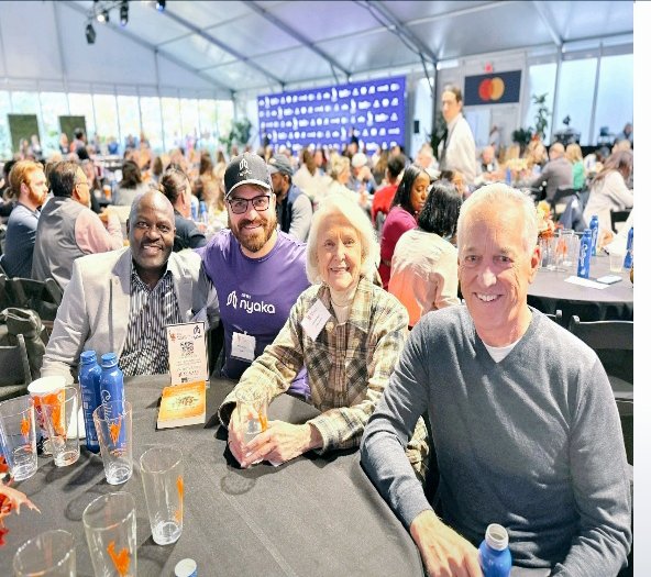 Twejaka's tweet image. Meet Sherrye Henry, the beautiful soul in a checked brouse in this picture a cherished friend and generous donor of @NyakaGlobal. She is currently facing health challenges, and I invite you all to join me in sending her prayers for a #quickrecovery. 
Sending love your way,