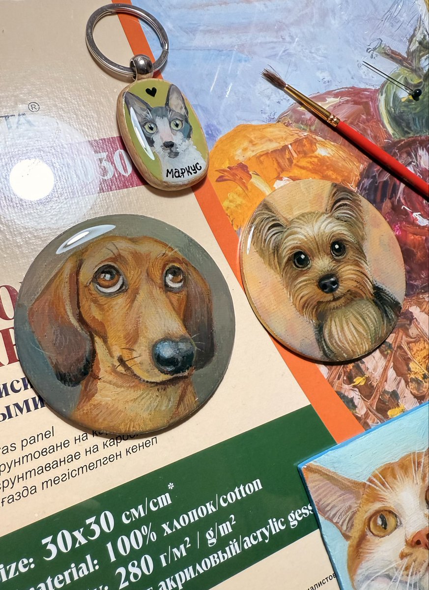 My talented wife is an illustrator and she also loves to draw miniatures. 

She just covered these two and the keychain with epoxy.