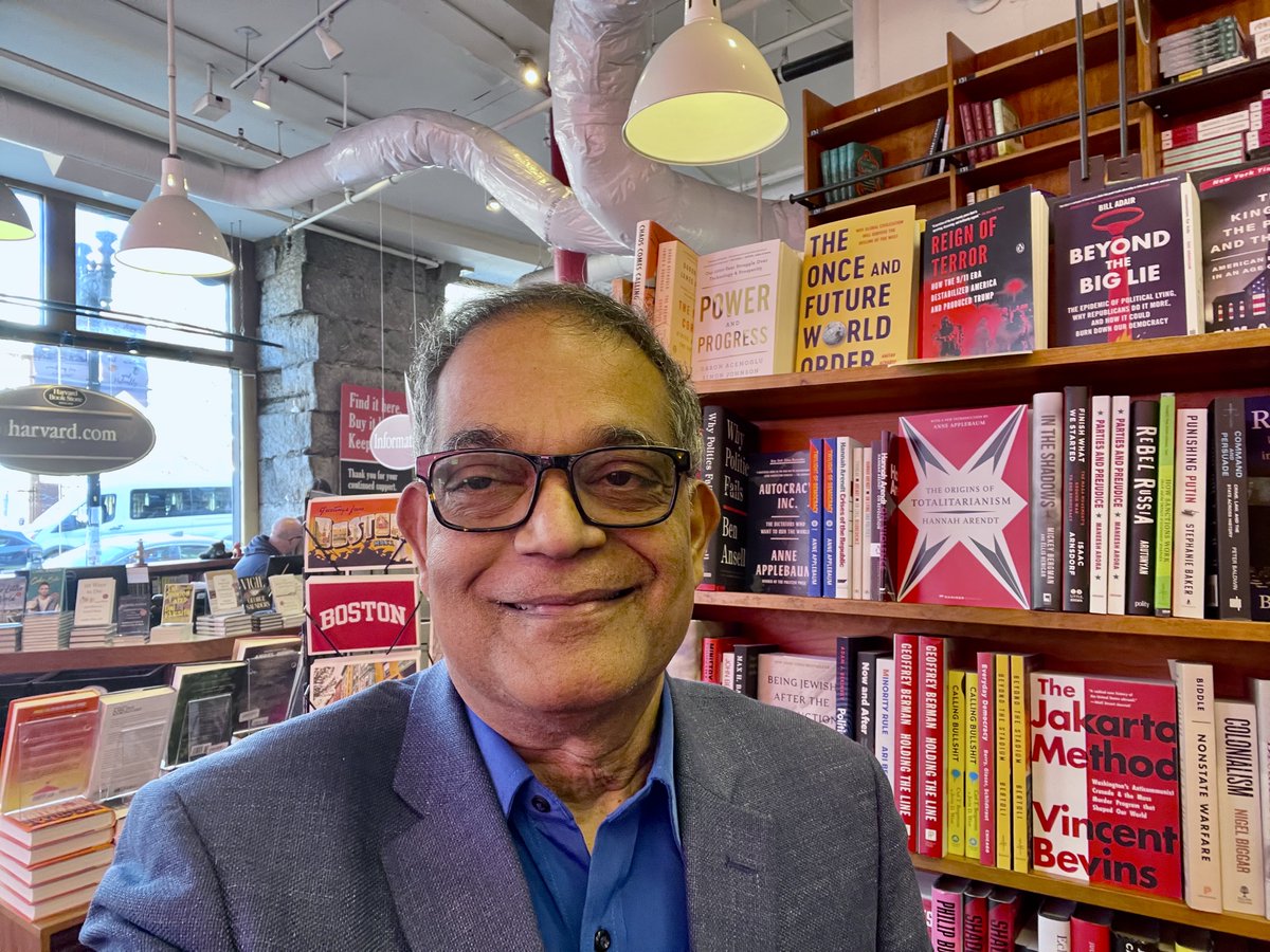 AmitavAcharya's tweet photo. Pleased to take a selfie with my book on the shelf at Harvard Bookstore alongside books by some really famous authors (DARON ACEMOGLU for example - because we both have surnames with A although Ace is one letter ahead of Ach). Even more delighted to see someone peeking at it. https://t.co/LgtxTSmRhC