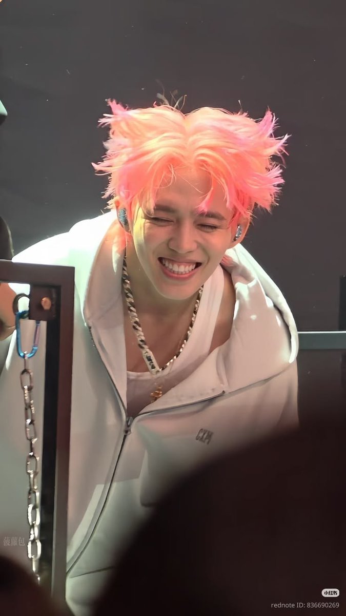 fried pink hair and a cute smile