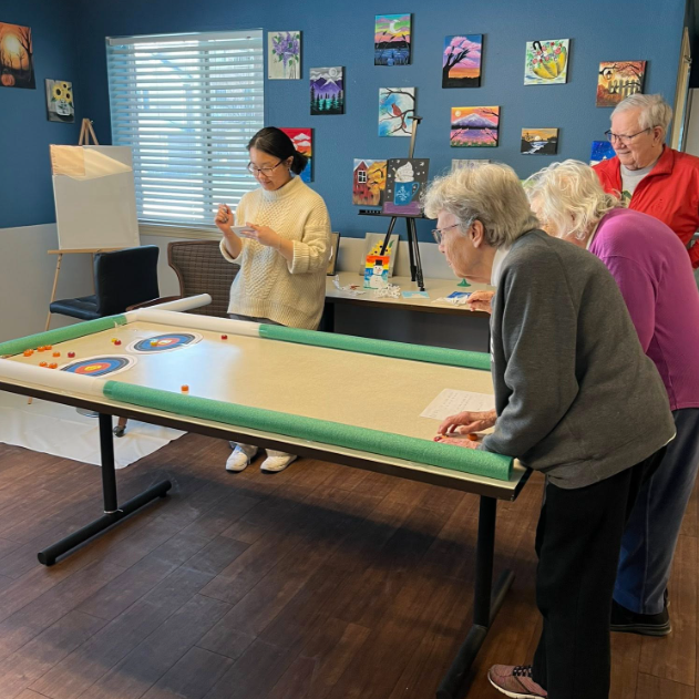 Recently a group of our Saint Paul team members volunteered at a local 55+ community to put on our "office" Olympics event for residents. Folks from operations, sales, and accounting set up tabletop bowling, curling, target toss and more to bring a little Olympic cheer to