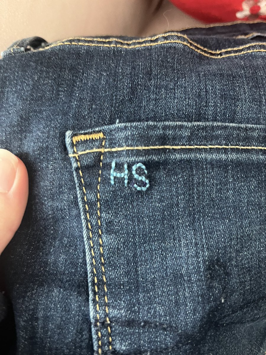 embroidering on jeans for my butch as a valentines gift :) those are my initials because her ass is MINE!!!! muahahaha