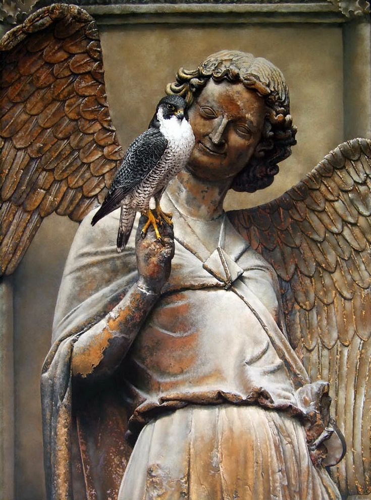 "Smiling Angel" statue with a falcon(?),  Reims Cathedral in France