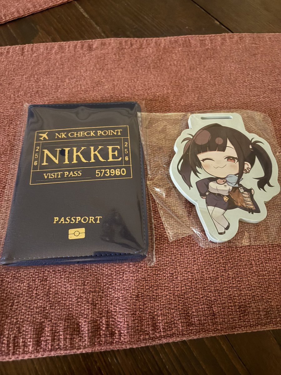 Sora and my passport came in the mail! So cute 🥰! Time to travel the world with her now 🤭! Thanks <a href="/NIKKE_en/">GODDESS OF VICTORY: NIKKE</a> for the nice gift 🎁 ❤️#Nikke #GoddessofVictoryNIKKE