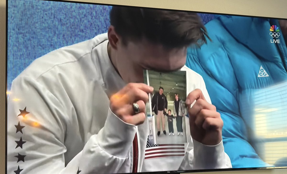 realJennaEllis's tweet photo. Heartbreaking to see Max Naumov hold up the picture of his parents (who were killed in the DC plane crash last year) after an amazing performance for @TeamUSA, and honor their legacy.

These are the stories of resilience and courage that inspire. 🇺🇸 https://t.co/n1aPTCjDWb