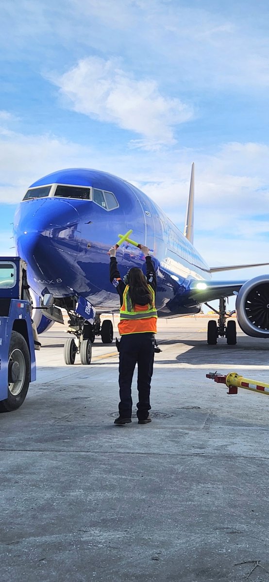 Our granddaughter,  Caylee Ann directing the plane at Southwest.