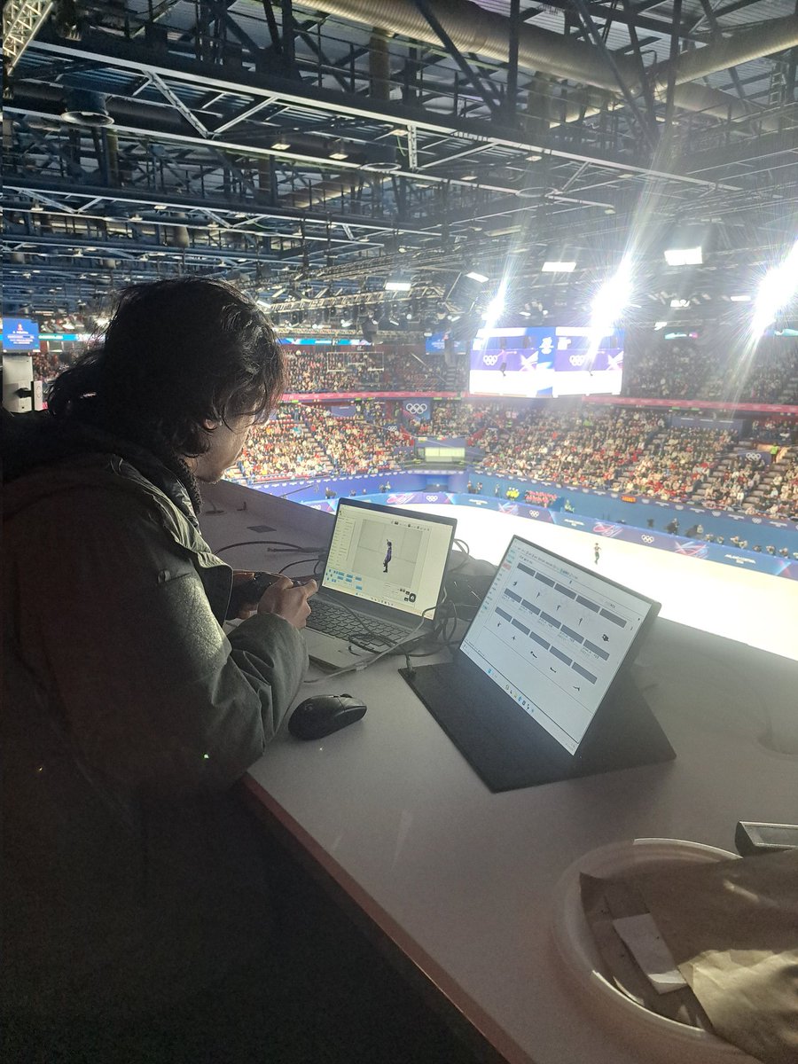 Tonight at the #MilanoCortina2026 figure skating, I was sat next to the guy who operates the spider cam and takes the aerial pictures. Amazing to see how it is done - he follows the action with a PlayStation controller and takes pictures with the shoulder buttons. Superb skill.