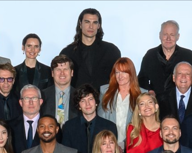 JillianSed's tweet photo. IMPORTANT: Can someone PLEASE tell me who this smoldering vampire making 6'3 Stellan Skarsgård look short in the Oscars 2026 class photo is?! https://t.co/lfAojGg6Dk