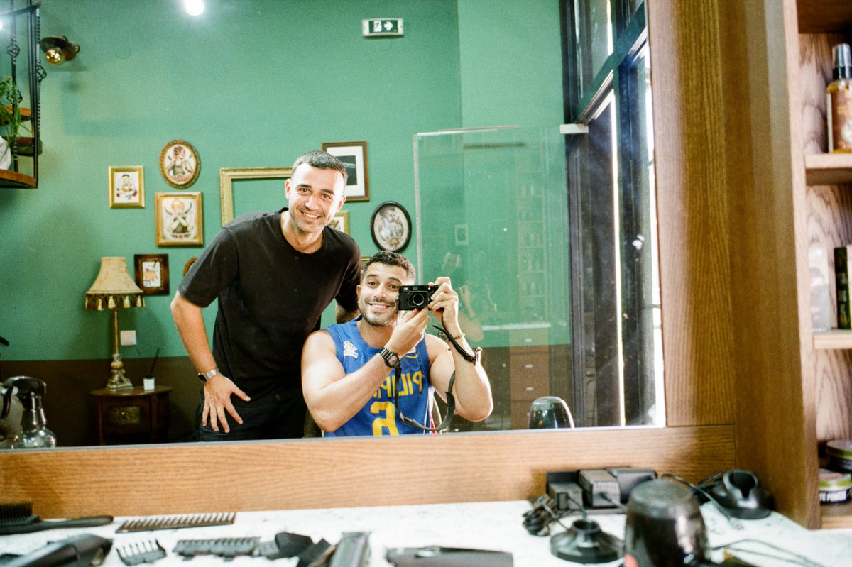 Advil's tweet photo. one of my favorite traditions while traveling is to get a haircut and take a selfie w my barber. i have haircut selfies from so many countries! https://t.co/SoDQiPqURz