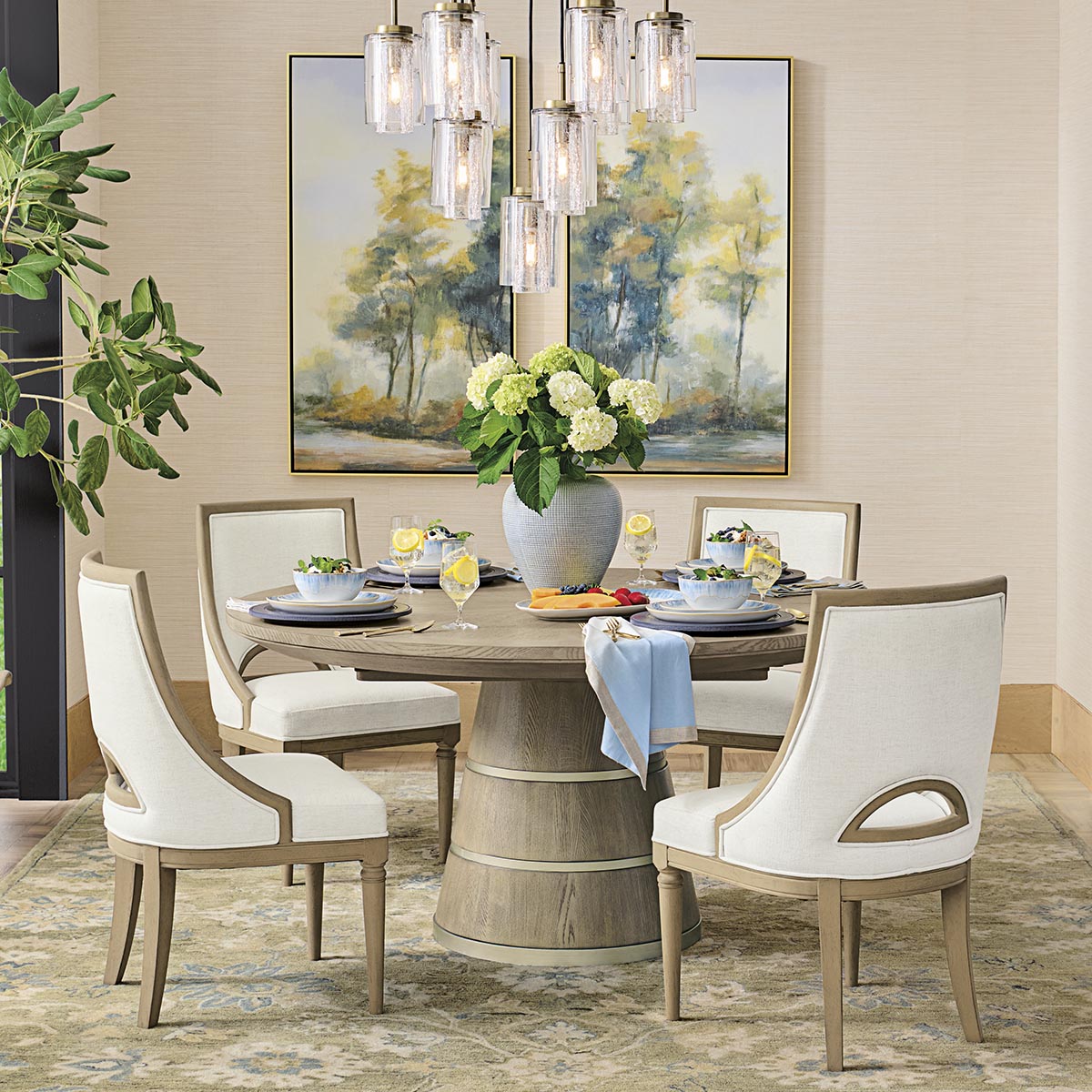 A vignette that’s sure to impress: We paired the Aniston Table with our Mercer Chairs for a fresh look in the dining room. Just add artwork, chic lighting and great friends. bit.ly/3Nu96GO