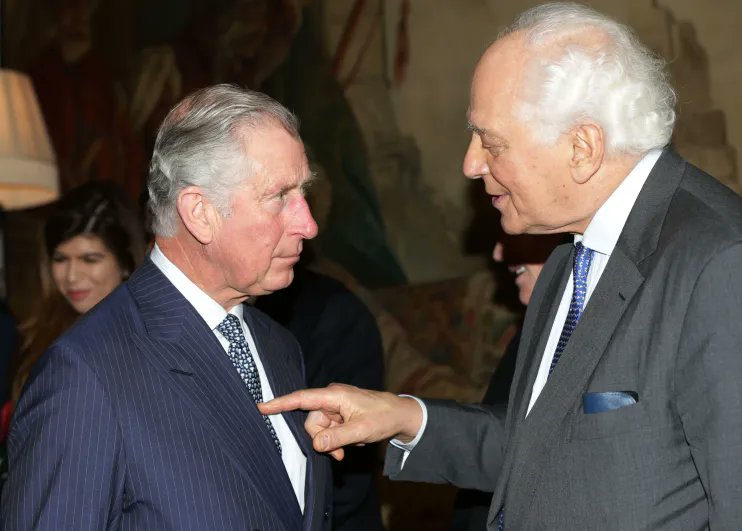 A classic photo of Sir Evelyn de Rothschild making sure King Charles (then Prince Charles) knows who really runs the show. 

You can't just jab your finger at a British Royal like that. 

Unless you are above them.