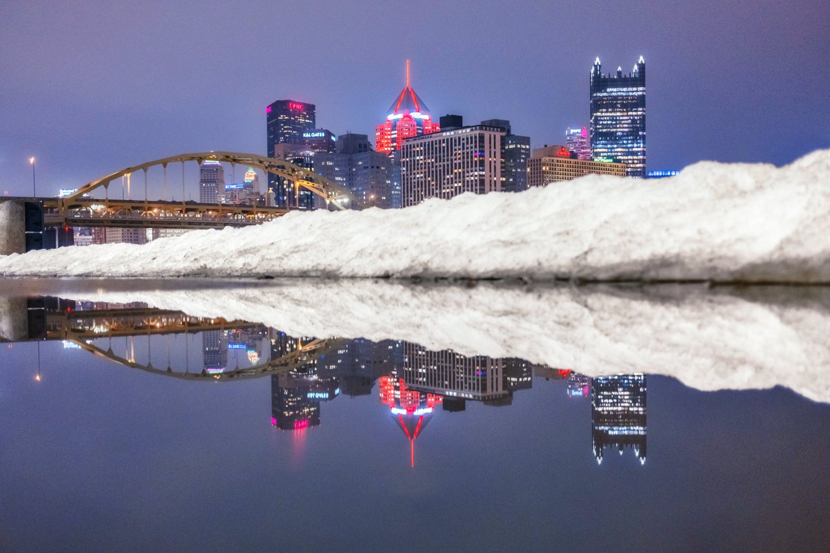 The melting snow has made for some interesting photo opportunities around #Pittsburgh, and this is one from the North Shore last night. The snowbank almost looks like a mini mountain range in front of the city as it reflects in a puddle on the riverwalk.