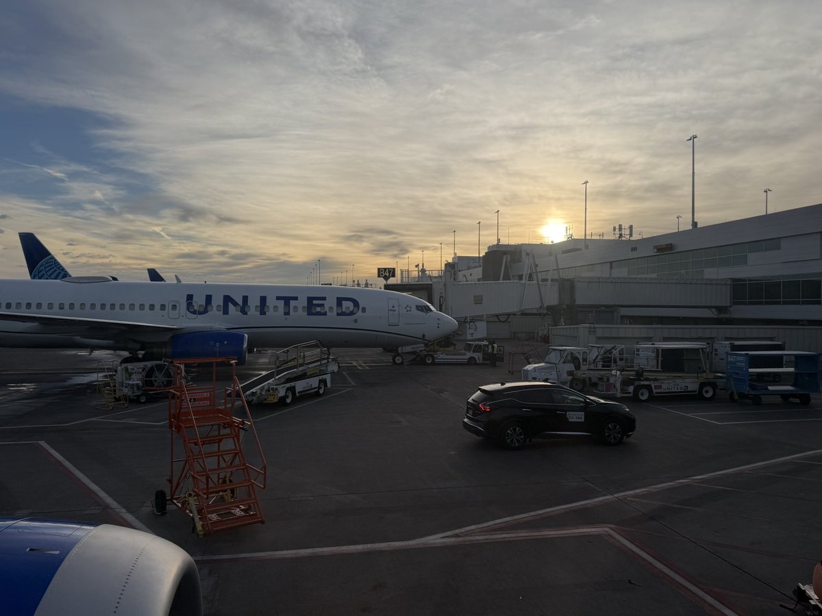 Sun coming over up <a href="/DENAirport/">Denver Int'l Airport</a>. Off on another <a href="/united/">United Airlines</a> flight. I’ve already earned gold status for 2027. 😂