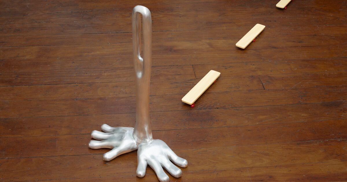 Xiang Huidi's "got no time to dilly-dally" at YveYANG Gallery scales fairy-tale labor into giant suspended 3D-printed aluminum sewing needles—sharp, industrial sheen with carbon fiber accents and dangling elements in metallic tones, creating immersive, dizzying commentary on