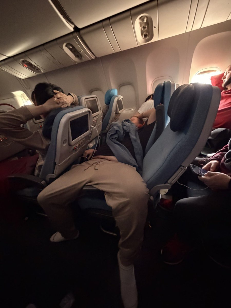 barstoolsports's tweet image. Is it appropriate to lay like this on a plane?