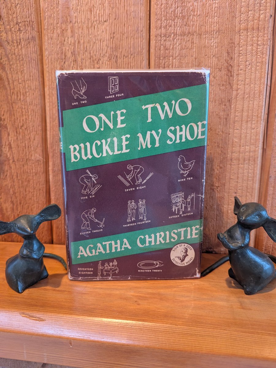'One, Two, Buckle My Shoe' by #AgathaChristie 1940 1st edition. A classic quote from this novel: "Order and method, they are my Gods" - #poirot  The jacket on this novel really leans into the nursery rhyme!