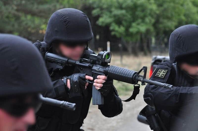 Operative from Georgian State Security Service using Bushmaster XM-15E2 5.56mm Carbine with Mepro M21 reflex sight, 2010s period.