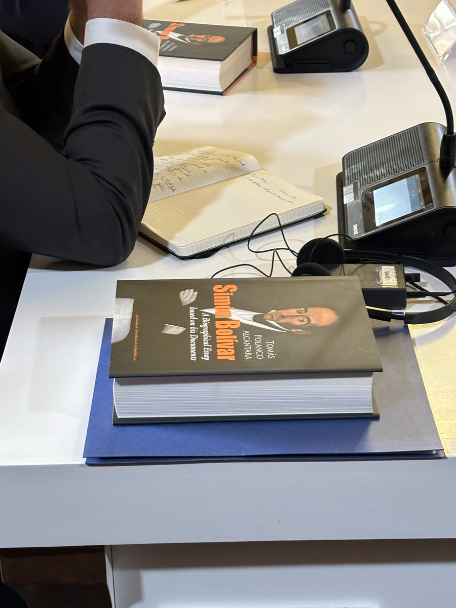annmarie's tweet photo. Spotted: The Venezuelan government  gifted the American delegation some light reading https://t.co/asJiavn1s3
