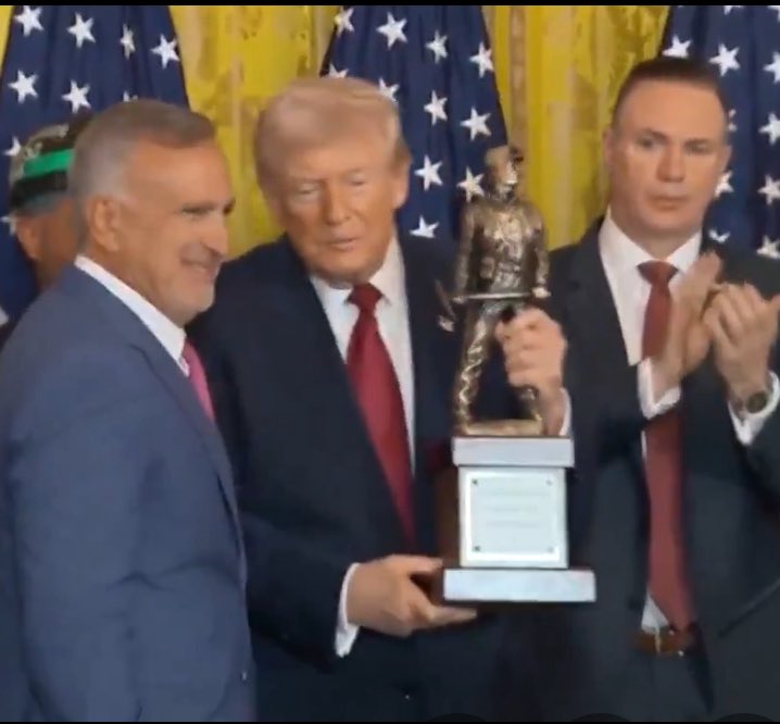 What is Trump getting a trophy for?