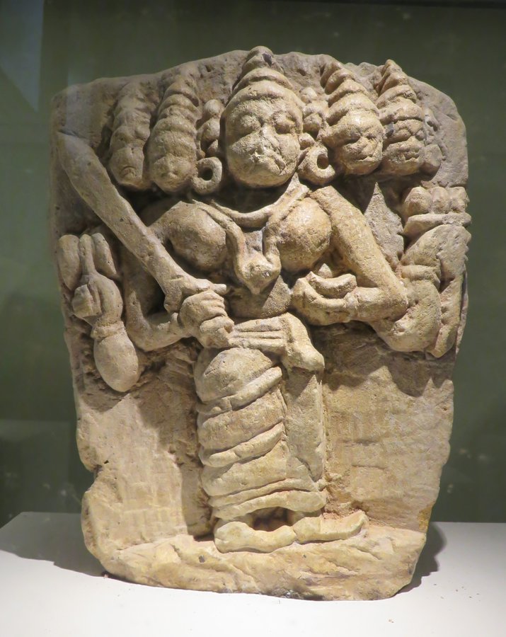 Five heads.

Not a garland.
Not decorative excess.
Not “folk exaggeration.”

A five-headed goddess from Wayanad.

Look closely.

The heads are structural — emerging from the same body.
This isn’t Kali wearing conquest.
This is multiplicity embodied.

Five heads = five directions.
