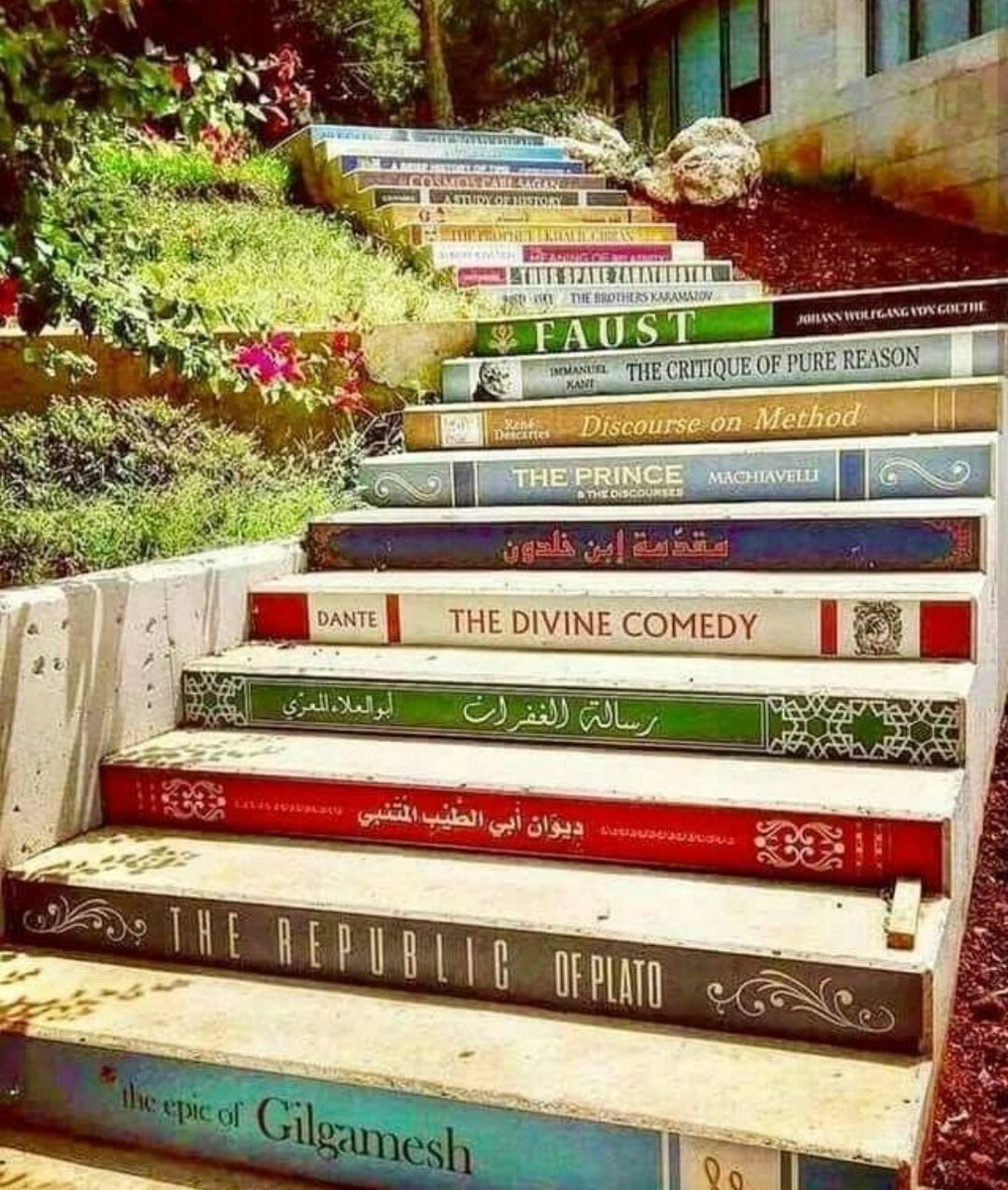 The 21 stairs at Balamand University, Lebanon 🇱🇧

The stairs are located right next to the Library building. The books are in chronological order (almost!) as follows, from bottom to top :

1 - The Epic of Gilgamesh;
2 - The Republic of Plato;
3 -Diwān Abū al-Ṭayyib al-Mutanbbī;