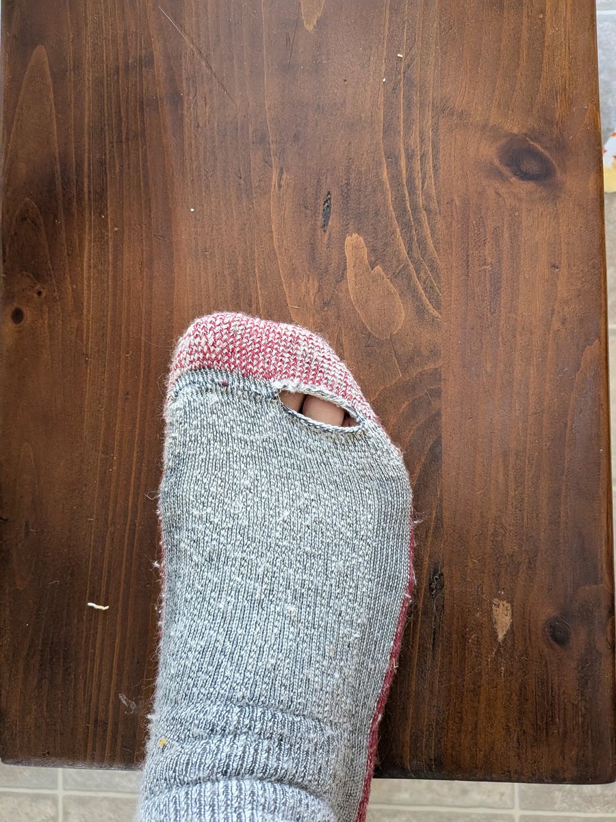 MeanMark87's tweet photo. I love @Smartwool socks, they're my favorite for winter boot socks. Never had this happen before, but these 1 month old Christmas present socks have torn for no apparent reason. Bummer. https://t.co/amjzrBvmj6