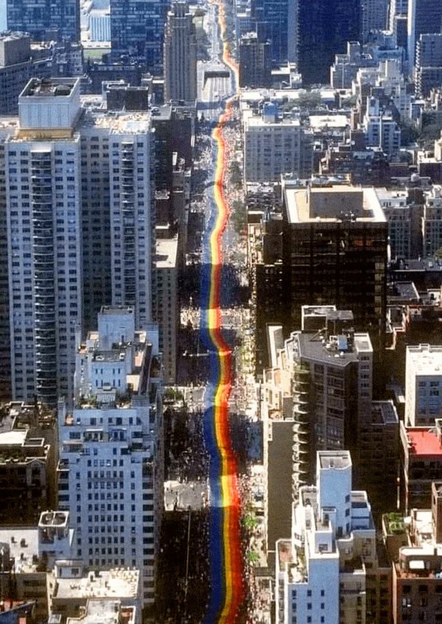 Gay activists carry a mile-long rainbow banner through New York City to mark the 25th anniversary of the Stonewall riots. June 26, 1994.