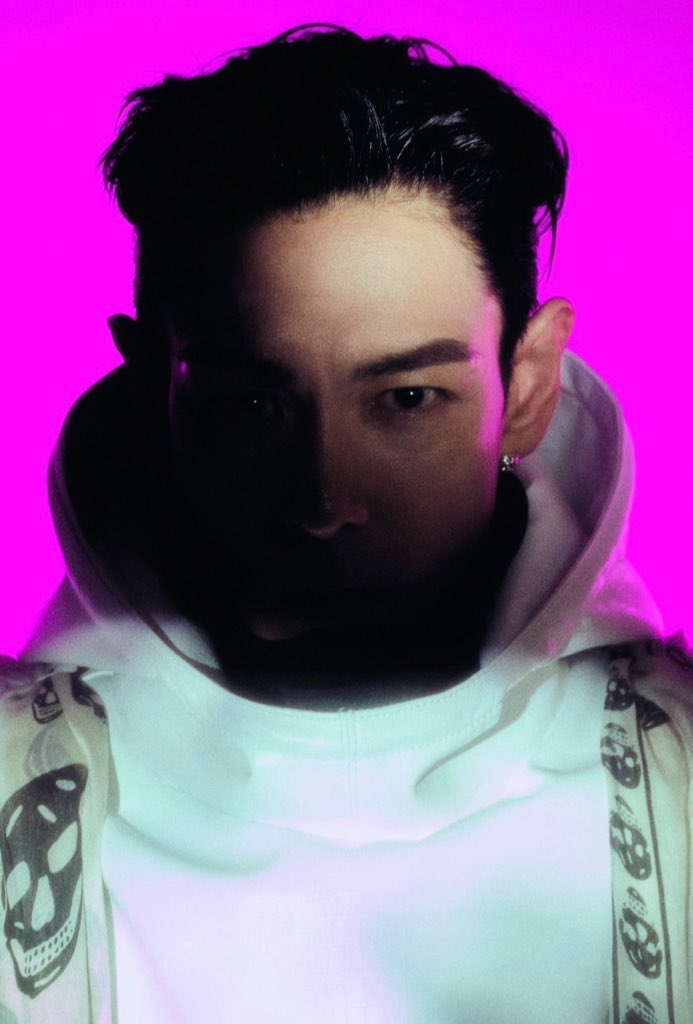 The red spacesuit and retro helmet from 2001: A Space Odyssey (1968) are iconic—calm, restrained, yet deeply philosophical and artistic. 

T.O.P seems to be wearing a white hoodie, though it’s hard to tell but it gives off the same space-like aura, like a modern, minimalist