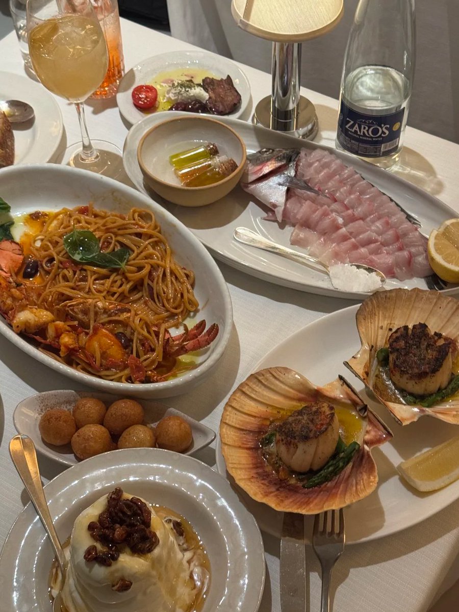 Fine dining dreams on a table ✨ From fresh seafood to buttery scallops, creamy burrata, and rich pasta every bite felt like a celebration. Great food, warm lights, and unforgettable vibes. Moments like these are meant to be tasted, shared, and remembered. 🍽️🤍