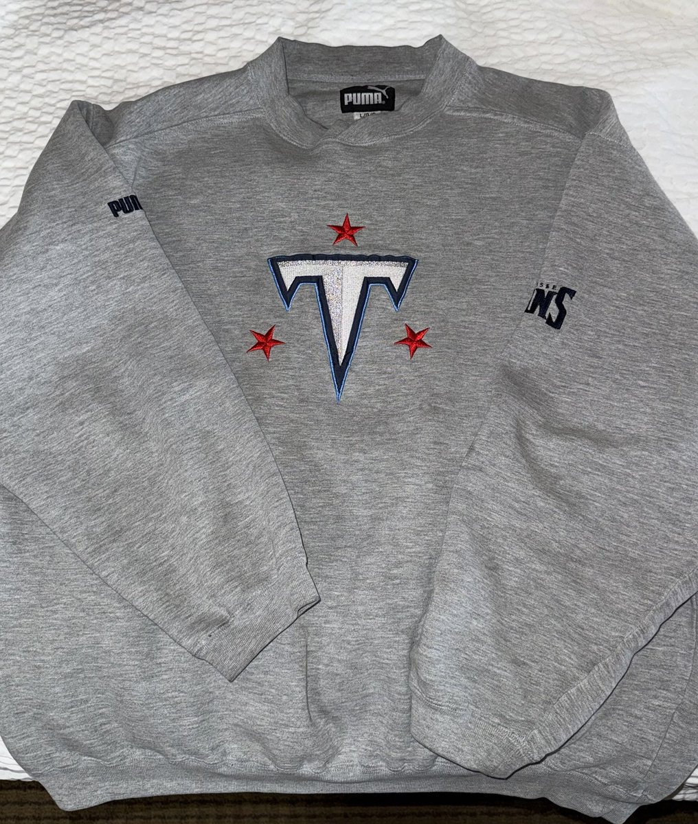 wesley_sergent's tweet photo. @ZachCohenFB @TitansUni I’ve seen the buzz around new unis &amp; a rebrand. I expect the new titans logo to look very similar to this. @PUMA made licensed @NFL gear for a short time, a 3 season run from 1999-2001. This grey crewneck is in my personal @titans vintage collection. https://t.co/ST6vVGkCwZ